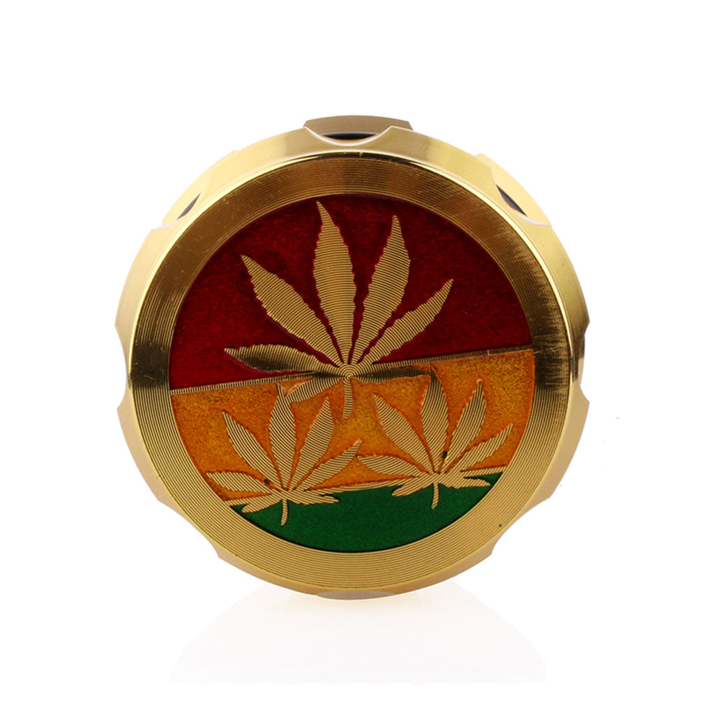 Gold-colored circular object with cannabis leaf design on a white background