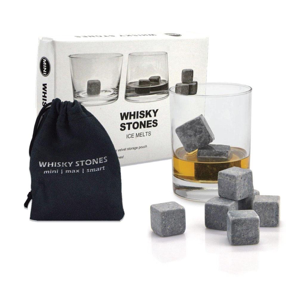 Whisky stones with a glass of whisky and packaging on a white background