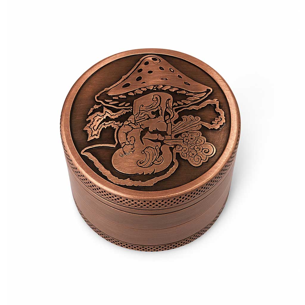 Copper-colored grinder with engraved design on a white background